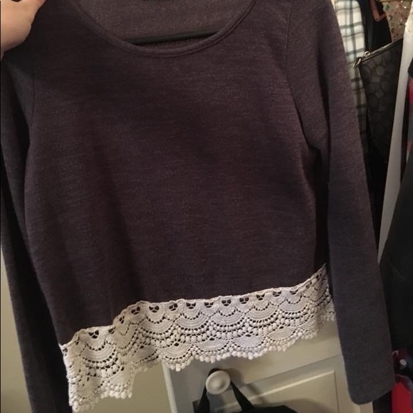 Cute crop fit top with lace bottom accent. - Picture 1 of 1